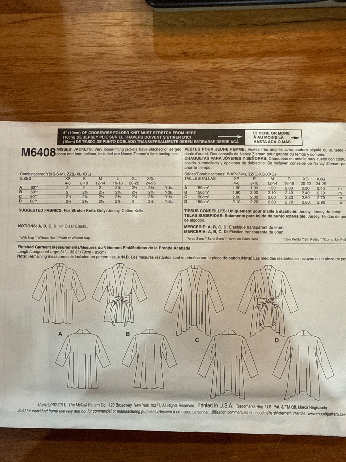 McCall’s M6408 envelope back showing jacket line drawings, size chart, stretch-knit fabric requirements, and notions.