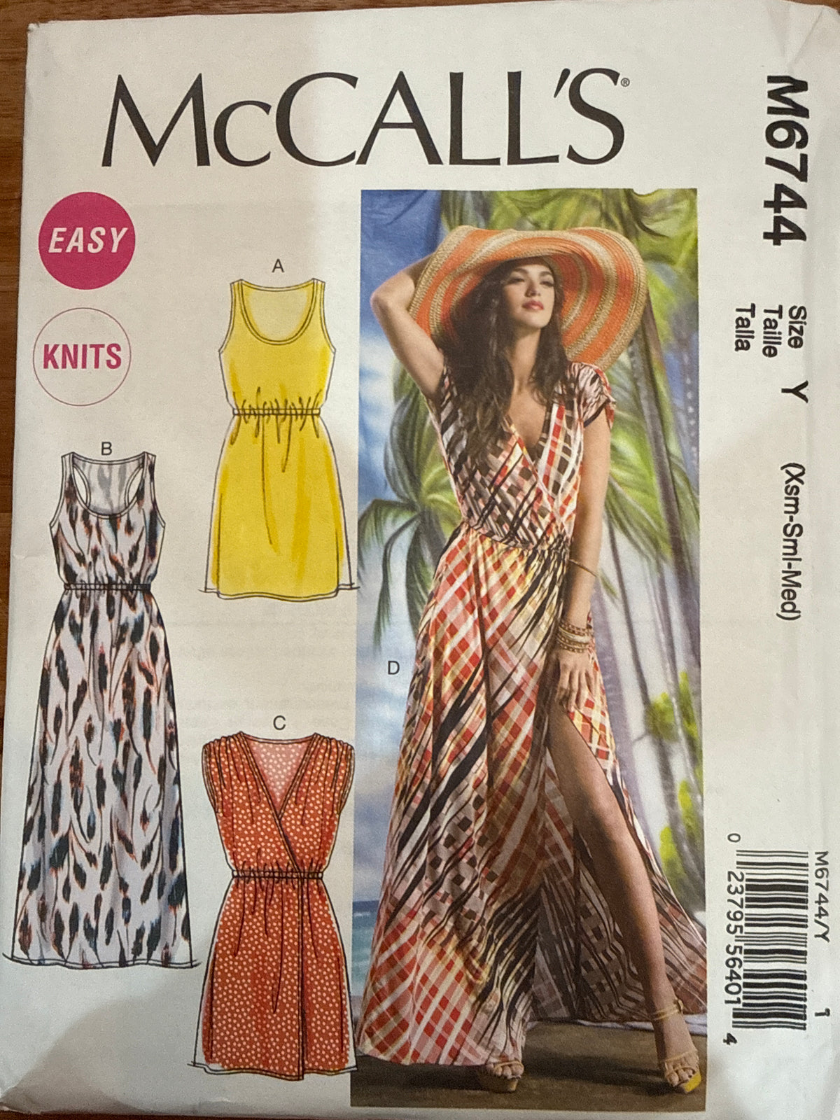 McCall’s M6744 sewing pattern envelope showing short and maxi knit dresses with elastic waists.