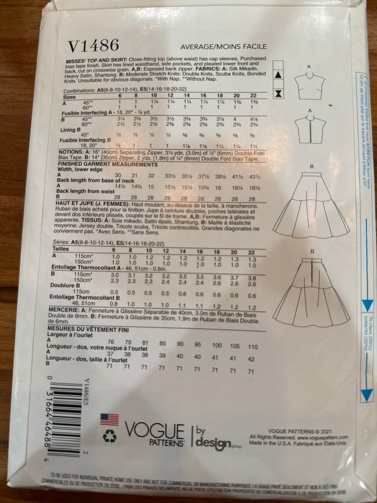 Vogue V1486 envelope back showing top and skirt line drawings, fabric requirements, notions, and finished measurements.