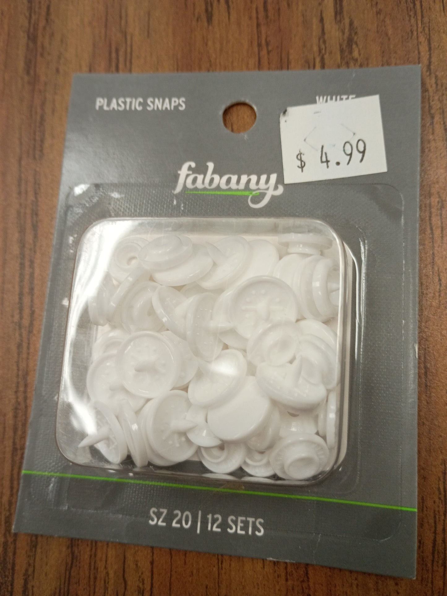 White plastic snaps